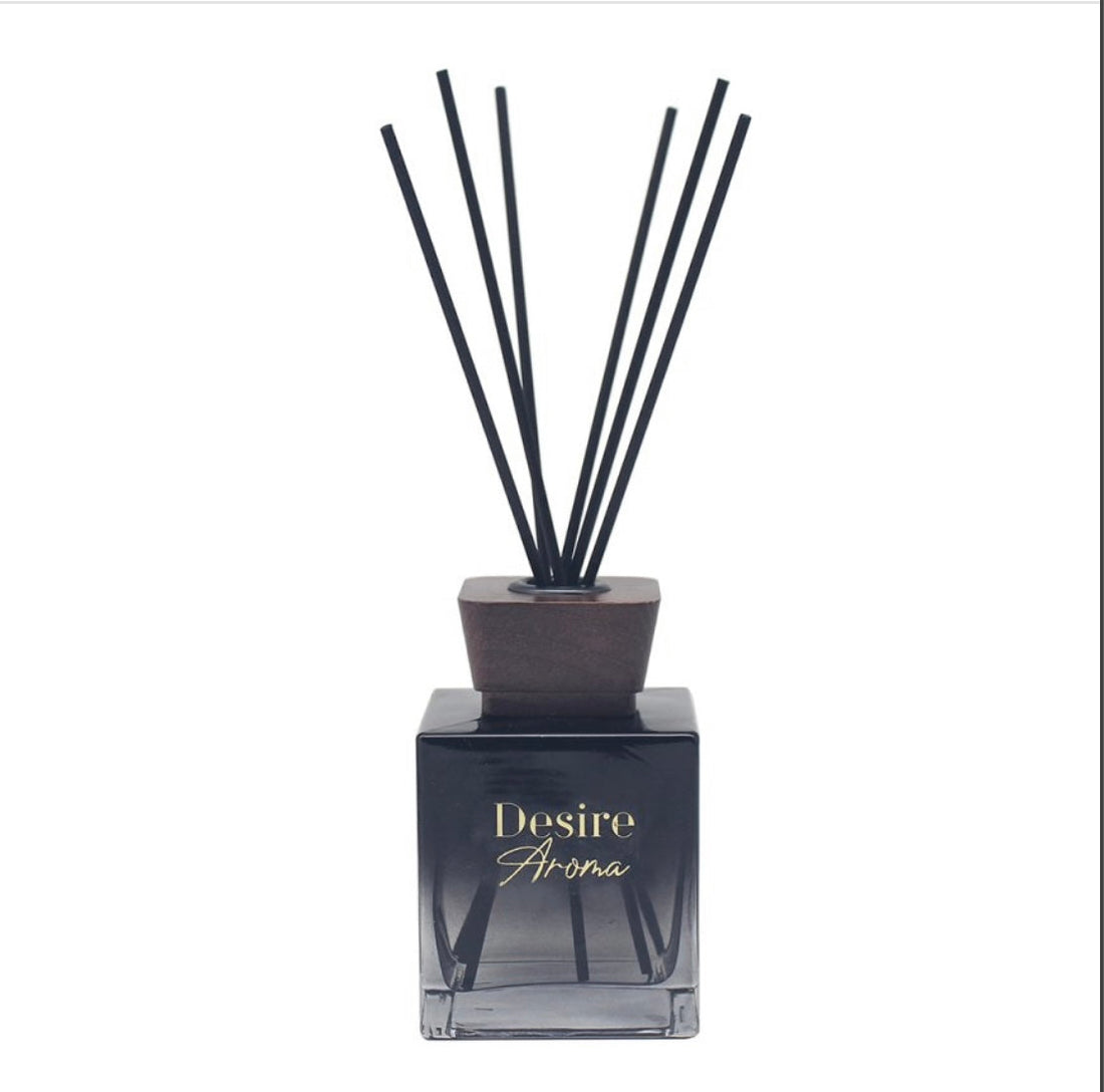 Oud & Bergamot reed diffuser on a living room side table