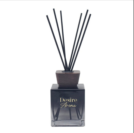 Oud & Bergamot reed diffuser on a living room side table